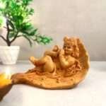 SAJAWATI Lord Krishna On Leaf Metal Idol Statue For Home Decorative Showpiece - 15 cm (Marble, Brown)
