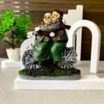 SAJAWATI SCOOTER DADA DADI Decorative Showpiece - 7 IN